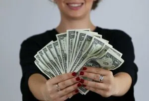 Woman holding dollars